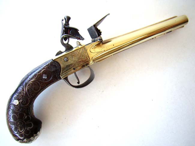 A Magnificent Brass Double Barreled Flintlock Pistol with Silver Inlays by John Parkes of London circa 1770.